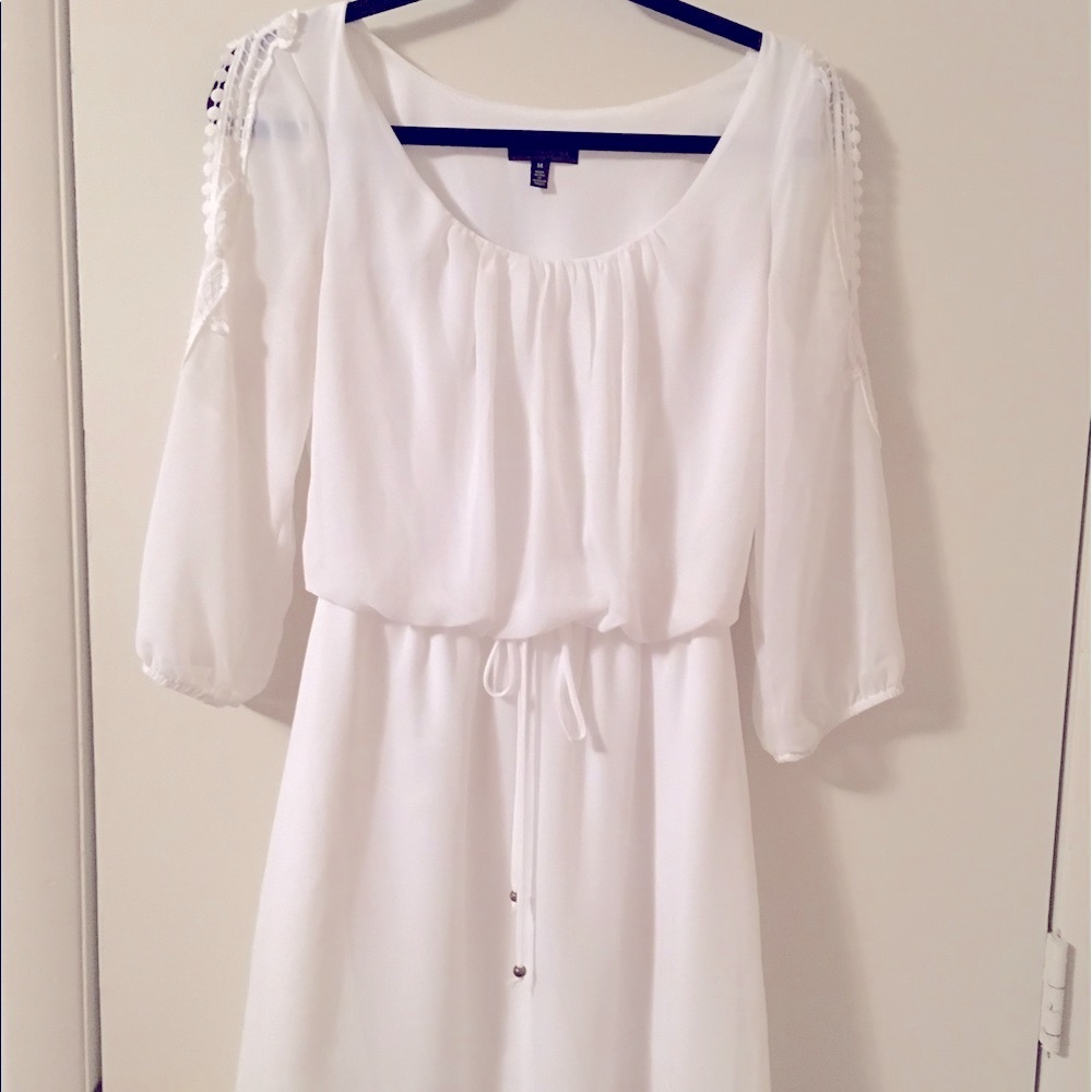 White dress with lace accent and tie waist